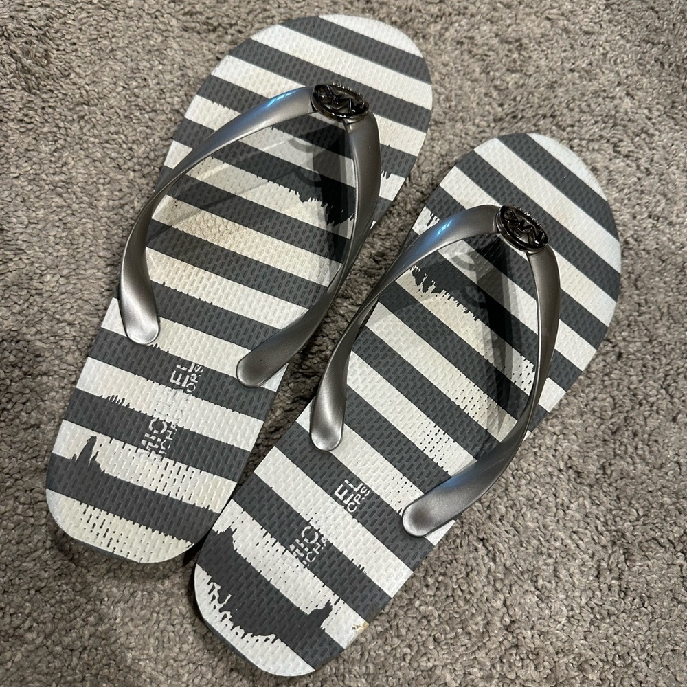 Never worn, Michael Kors flip flops